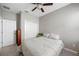 Neutral guest bedroom with a bed, wooden furniture, fan, and closet at 1811 Redmond Brook Ln, Ruskin, FL 33570