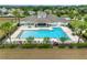 Community pool with inviting leisure areas, manicured landscaping, and sun loungers, providing a resort-style experience at 1811 Redmond Brook Ln, Ruskin, FL 33570