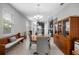 Open dining area with views of the kitchen and entryway, providing an ideal space for Gathering gatherings at 1811 Redmond Brook Ln, Ruskin, FL 33570