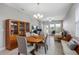 Cozy dining space featuring elegant furnishings, abundant natural light, and seamless access to the living areas at 1811 Redmond Brook Ln, Ruskin, FL 33570