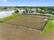 Large fenced dog park for residents, with benches, water access and grassy areas at 1811 Redmond Brook Ln, Ruskin, FL 33570