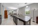 Spacious kitchen with granite countertops overlooking dining and living areas, perfect for entertaining at 1811 Redmond Brook Ln, Ruskin, FL 33570