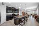 Well-appointed kitchen with stainless steel appliances, a center island, and views of the dining and living areas at 1811 Redmond Brook Ln, Ruskin, FL 33570