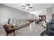 Open-concept living space featuring tile flooring and neutral decor connecting to the dining area and kitchen at 1811 Redmond Brook Ln, Ruskin, FL 33570