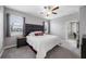 Bright bedroom with carpet floors and views from large windows, enhanced by neutral-toned decor and accents at 1811 Redmond Brook Ln, Ruskin, FL 33570