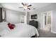 Bright main bedroom with carpet floors, featuring ensuite bathroom and comfortable furnishings at 1811 Redmond Brook Ln, Ruskin, FL 33570