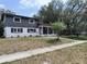 Charming two-story home featuring a freshly painted exterior and well-maintained front yard at 1907 E 111Th Ave, Tampa, FL 33612