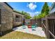 Cozy backyard with pea gravel, wooden fence, and cute turquoise seating area at 233 24Th N St, St Petersburg, FL 33713