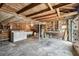 Unfinished basement with laundry area and wood plank ceiling at 233 24Th N St, St Petersburg, FL 33713