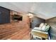 Cozy bedroom with wood paneling, and mounted TV at 233 24Th N St, St Petersburg, FL 33713