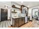 Kitchen with stainless steel appliances, granite counters, open shelving, and a view into the dining room at 233 24Th N St, St Petersburg, FL 33713