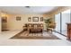 The open concept living room features lots of light, a plant, and a carpet at 2509 Lambdin Dr, Sun City Center, FL 33573