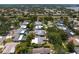 This aerial view highlights the community and the proximity to the neighborhood lake at 2665 Clubhouse N Dr, Clearwater, FL 33761