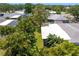 Aerial view of the home and backyard, surrounded by lush landscaping at 2665 Clubhouse N Dr, Clearwater, FL 33761