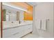 Modern bathroom featuring double sink vanity with white countertops and sleek cabinetry at 2665 Clubhouse N Dr, Clearwater, FL 33761