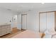 Light and airy bedroom with hardwood floors and ample closet space at 2665 Clubhouse N Dr, Clearwater, FL 33761