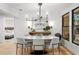 Chic dining room with modern lighting, stylish decor, and view of bedroom at 2665 Clubhouse N Dr, Clearwater, FL 33761