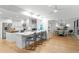 Open-concept kitchen with granite countertops and breakfast bar, adjacent to the dining area at 2665 Clubhouse N Dr, Clearwater, FL 33761