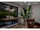 Comfortable living room featuring a large window, stylish decor, and a cozy leather armchair at 2665 Clubhouse N Dr, Clearwater, FL 33761