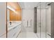 Spa-like bathroom with dual vanities, modern fixtures, and glass-enclosed shower at 2665 Clubhouse N Dr, Clearwater, FL 33761