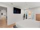Bright bedroom with ceiling fan, en suite access, and mounted television at 2665 Clubhouse N Dr, Clearwater, FL 33761