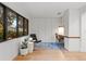 Home office with built-in desk, storage, and a bright window at 2665 Clubhouse N Dr, Clearwater, FL 33761