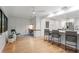 Modern office space leading into a kitchen area with a breakfast bar at 2665 Clubhouse N Dr, Clearwater, FL 33761