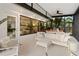 Inviting outdoor patio with comfortable seating and a grill, perfect for entertaining at 2665 Clubhouse N Dr, Clearwater, FL 33761