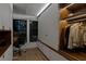 Spacious walk-in closet featuring custom shelving, ample storage, and stylish lighting at 2665 Clubhouse N Dr, Clearwater, FL 33761