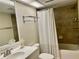 Cozy bathroom featuring a shower-tub combo with stylish tile and updated vanity at 29129 Bay Hollow Dr # 3201, Wesley Chapel, FL 33543