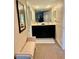 Hallway bathroom featuring dual sinks, well-lit vanity and classic finishes at 29129 Bay Hollow Dr # 3201, Wesley Chapel, FL 33543
