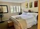 A relaxing bedroom with a Queen bed, comfortable decor and lots of light from plantation shutters at 29129 Bay Hollow Dr # 3201, Wesley Chapel, FL 33543