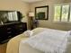 A well lit and inviting bedroom with comfortable decor and a view of the outdoors at 29129 Bay Hollow Dr # 3201, Wesley Chapel, FL 33543