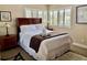 Comfortable bedroom featuring plush bedding and bright natural light from the shuttered windows at 29129 Bay Hollow Dr # 3201, Wesley Chapel, FL 33543
