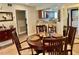 Cozy dining room featuring a wooden table with seating for four near the kitchen and the rest of the condo at 29129 Bay Hollow Dr # 3201, Wesley Chapel, FL 33543
