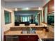 Open concept kitchen with granite countertops and stainless appliances looking to the living room at 29129 Bay Hollow Dr # 3201, Wesley Chapel, FL 33543