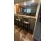 Kitchen with breakfast bar and stainless steel appliances is open to the living areas at 29129 Bay Hollow Dr # 3201, Wesley Chapel, FL 33543
