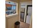 Open concept kitchen with stainless appliances, granite countertops, and laundry closet at 29129 Bay Hollow Dr # 3201, Wesley Chapel, FL 33543