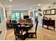 Open-concept living and dining area with view of the patio at 29129 Bay Hollow Dr # 3201, Wesley Chapel, FL 33543