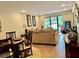 Living and dining area with stylish decor, natural light, and patio view at 29129 Bay Hollow Dr # 3201, Wesley Chapel, FL 33543