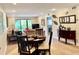 Open-concept living and dining area with view of the patio at 29129 Bay Hollow Dr # 3201, Wesley Chapel, FL 33543