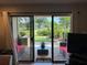 Cozy back patio with brick pavers, furniture, and a beautiful view of the grassy field at 29129 Bay Hollow Dr # 3201, Wesley Chapel, FL 33543