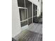 Exterior of property features a wooden screened-in porch at 3145 Meta Ct, Largo, FL 33771