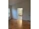 Bedroom with laminate floor and ensuite bathroom entrance at 3145 Meta Ct, Largo, FL 33771