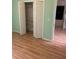 Bedroom with laminate floors and closet with shelving for ample storage space at 3145 Meta Ct, Largo, FL 33771