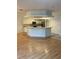 Kitchen with white cabinets, stainless steel appliances, and a breakfast bar at 3145 Meta Ct, Largo, FL 33771