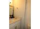 Bathroom features a sink vanity, with a white marble countertop, and a large mirror at 3424 Truman Dr, Holiday, FL 34691