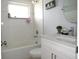 Bathroom featuring a shower and bath combination and a sink vanity with marble countertop at 3424 Truman Dr, Holiday, FL 34691