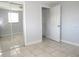 Bedroom with tile flooring, a mirrored closet, and access to the home's hallway at 3424 Truman Dr, Holiday, FL 34691