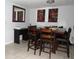 Traditional dining room with a wooden table, seating for six, and decorative wall art at 3424 Truman Dr, Holiday, FL 34691